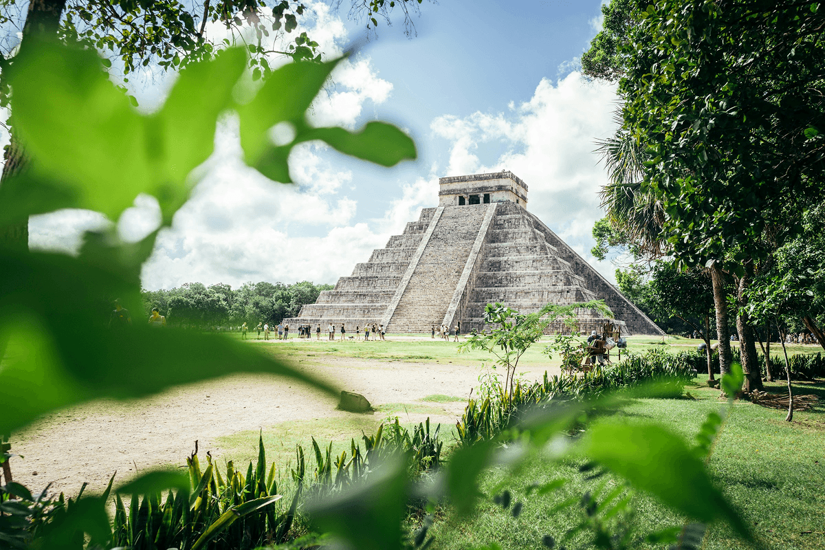 Chichen Itza surrounded by tropical greenery